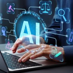 2 Hände, die auf einem Tablet tippen mit futuristischen Zeichen im Vordergrund und ein Text AI.